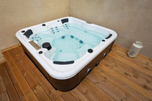 Hot tub on a wooden floor in a house