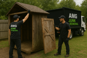 Two men working on a wooden shed