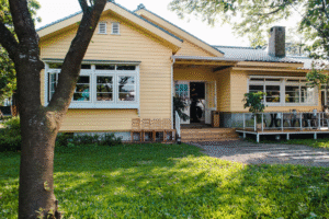 A Maple Heights home with an open yard and clean exterior view after fence removal