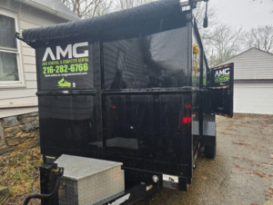 A roll-off dumpster in a residential driveway for a home project